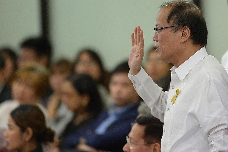 Former president Benigno Aquino testifying during the vaccine controversy congressional hearing in Manila in February.