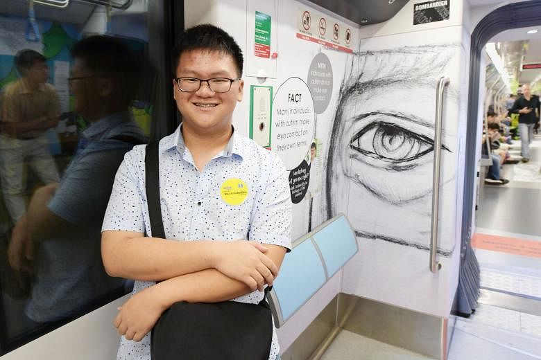 A woman walking by works of art by Ng Li Jie, 21, (on the left), and Sean Bay, 22, on a Downtown Line train. Choo Jian Wei (below left), 17, with his sketch on the same train.