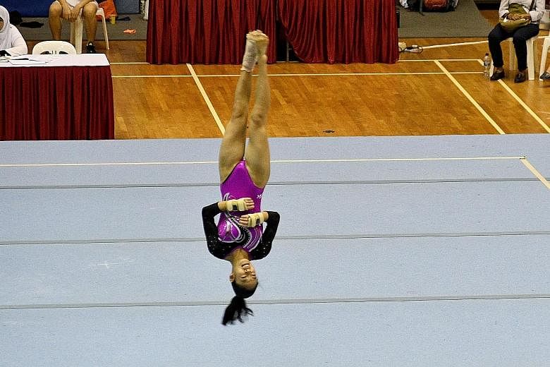 Shayne Tan of Nanyang Girls' High School during her floor exercise at the Schools National Gymnastics Championships yesterday. She won all the individual events on offer.