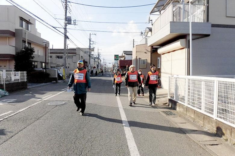 An Orange patrol, which is conducted regularly by supporters in Matsudo city, Chiba prefecture. The nationwide Orange Plan was launched in 2015 to provide a comprehensive suite of dementia detection and support initiatives. People with dementia takin