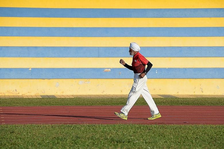 Mr Ajit Singh Gill training at Yio Chu Kang Stadium. He has represented Singapore in hockey, cricket and golf, and at the 1956 Melbourne Olympics. Now, he has taken up race walking and has won gold five times in regional events.