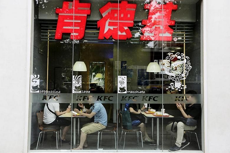 Customers having lunch at a KFC restaurant in Beijing. The chain was among those targeted by calls for a boycott, but analyst Ben Cavender say surveys show service brands that employ mostly Chinese citizens are viewed more positively.