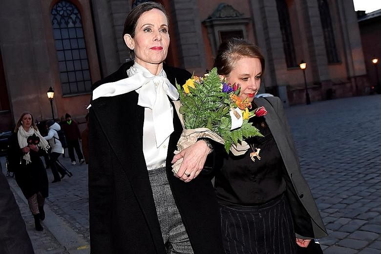 Former permanent secretary Sara Danius (left) on the day of her resignation, leaving the academy with member Sara Stridsberg. She had failed to receive support for reforms in the wake of the scandal.