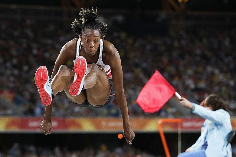 Ugen competing in the long jump final, where she finished fourth.