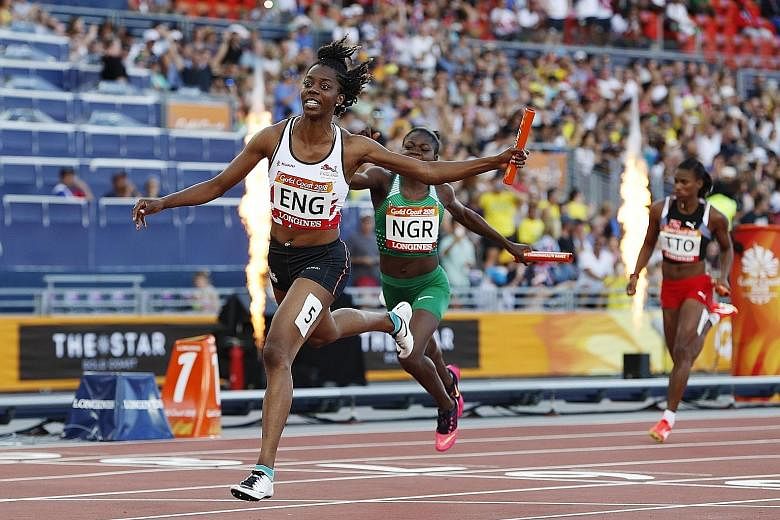 Lorraine Ugen anchoring England to the 4x100m gold, ahead of Nigeria's Rosemary Chukwuma.