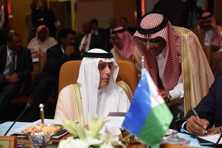 Saudi Arabia's Foreign Minister Adel al-Jubeir speaking to an aide during the preparatory meeting of Arab Foreign Ministers ahead of the 28th Summit of the Arab League in Riyadh on Thursday.