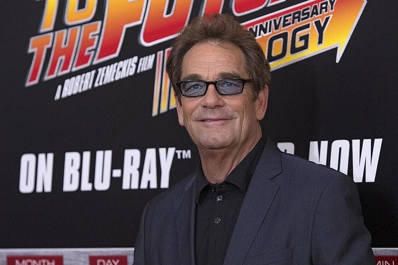 Singer Huey Lewis (right) said doctors believe he may be suffering from Meniere's disease, an inner-ear disorder that causes vertigo, ringing in the ear and permanent hearing loss.