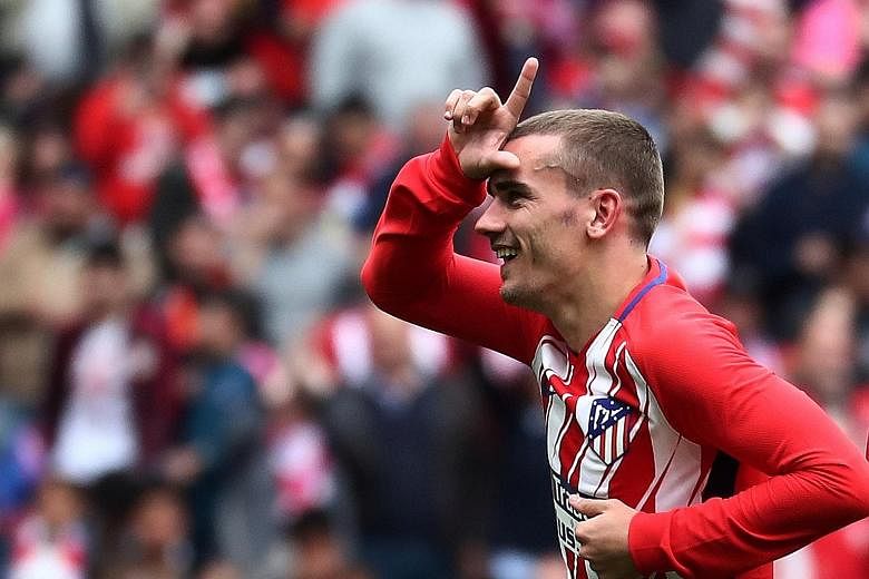 Atletico Madrid's Antoine Griezmann, celebrating his LaLiga goal against Levante yesterday, is a star who could turn out for the Spanish side in July's International Champions Cup in Singapore.