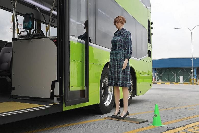 A mannequin being used to demonstrate the effectiveness of the side-mounted sensors, which can be seen near the rear of the bus. There are also ultrasonic sensors on the roof to warn drivers if they are about to hit an overhead obstacle.