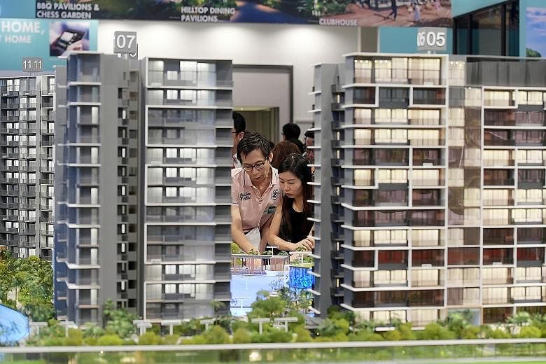 Potential buyers at the launch of Grandeur Park Residences. It was the second top-selling project last month, with 40 units sold. Crowds at The Tapestry's showroom last month. City Developments moved 329 units at the Tampines project last month at a 