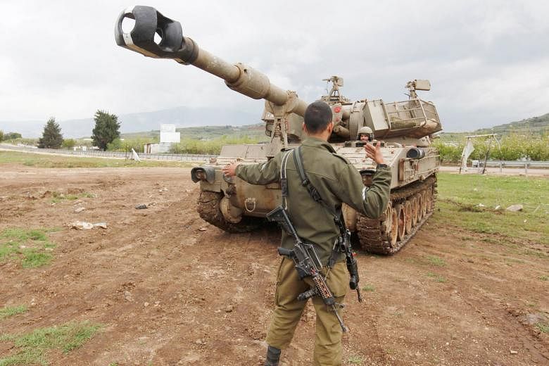 Israeli soldiers training in the annexed Golan Heights. In the past few weeks - for the first time ever - Israel and Iran have begun quietly trading blows directly in Syria. Israel and Iran are now a hair-trigger away from going to the next level - a