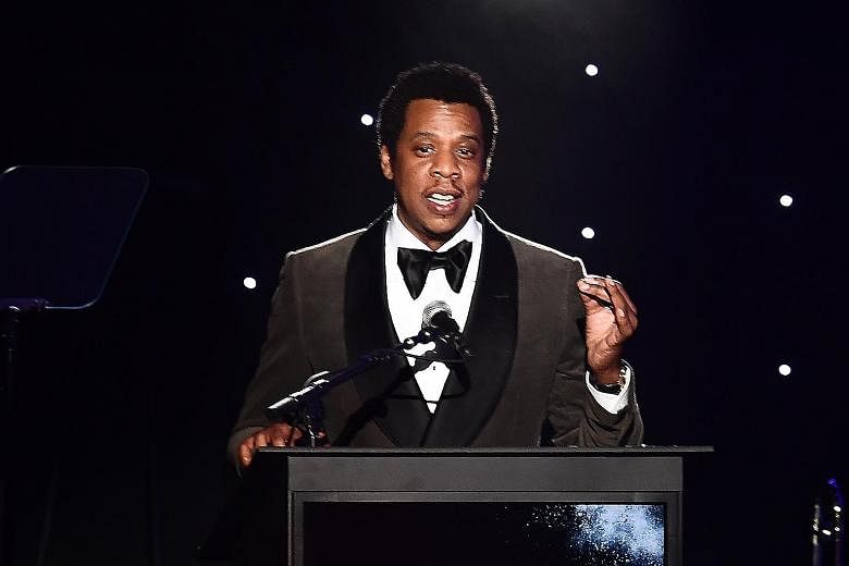 Rap mogul Jay-Z (far left) says he connected with his sixth-grade teacher, Ms Renee Rosenblum-Lowden (left), who instilled in him a love of words.