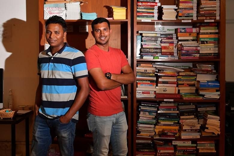Book lovers Fazley Elahi Rubel (in red T-shirt) and A. K. Zilani, together with Mr Ripon Chowdhury (not in picture), set up a library for migrant workers.
