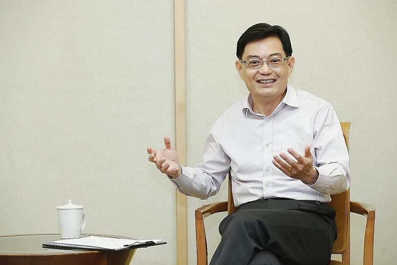 Mr Heng Swee Keat stressed the importance of continuing to develop Singaporeans, adding that "a well-calibrated inflow of foreign manpower" can complement the workforce.
