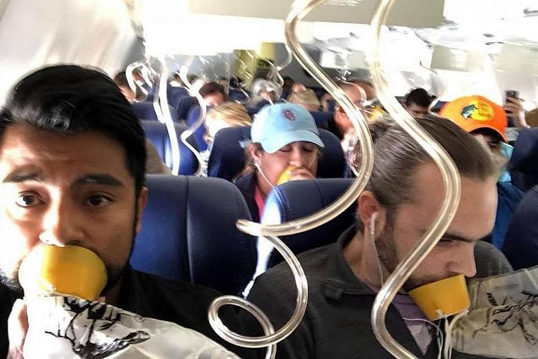 Passengers on board the Dallas-bound Southwest Airlines flight from New York, which made an emergency landing. After an engine on the plane's left side blew, it threw off shrapnel, shattering a window and causing cabin depressurisation that nearly pu