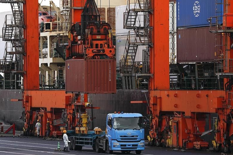An international cargo terminal in Tokyo. Data out yesterday showed Japan's shipments last month grew 2.1 per cent from the same period a year ago, below the 4.7 per cent annual increase expected by economists in a Reuters poll. In February, exports 