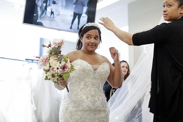 Full-size brides such as Ms Josefina Rodriguez now have more wedding dress choices.