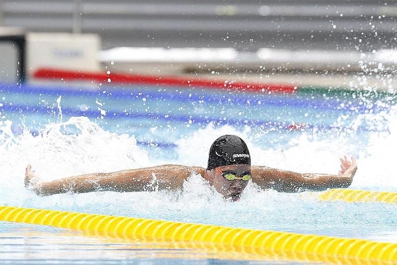 Mikkel Lee of Anglo-Chinese School (Independent) on his way to equalling his personal best and setting a meet record of 24.73sec in the B Division 50m butterfly final at the OCBC Aquatic Centre yesterday.