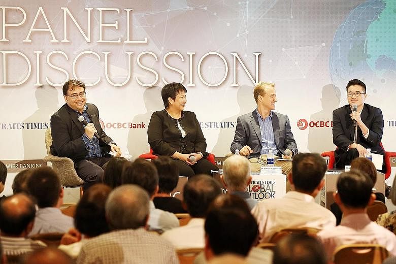 (From left) The Straits Times' foreign editor Zakir Hussain, who was the moderator, with OCBC Bank's Ms Selena Ling, ISEAS - Yusof Ishak Institute's Dr Francis Hutchinson and ST's Malaysia bureau chief Shannon Teoh at yesterday's ST Global Outlook Fo