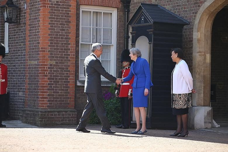 Prime Minister Lee Hsien Loong with British Prime Minister Theresa May and Secretary-General of the Commonwealth Patricia Scotland at Friary Court yesterday.