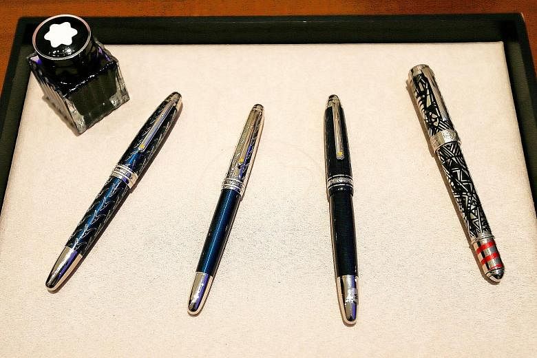 The writing instruments (above) from German luxury goods manufacturer Montblanc are often handcrafted with premium materials. South Africa-born craftsman Axel Nier (top) was in Singapore recently to showcase Montblanc's pen nibs, all of which are eng