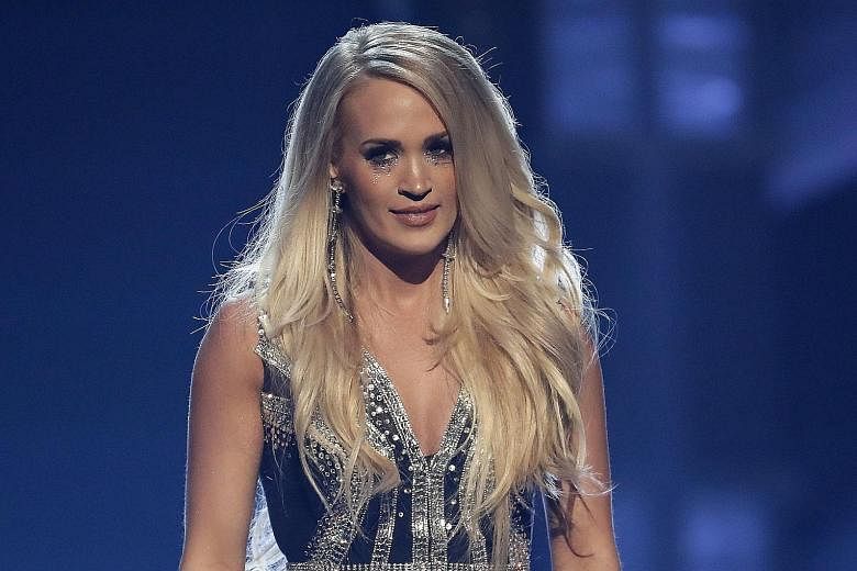 Carrie Underwood's face looked normal when she performed at the Academy of Country Music Awards on Sunday.