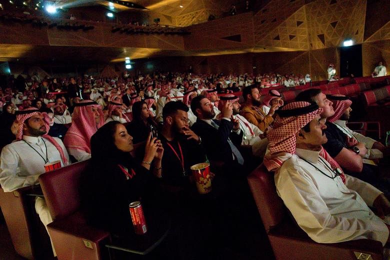 Saudis enjoying a VIP screening of Black Panther in Riyadh on Wednesday. AMC Entertainment, which opened the theatre, plans to open at least 40 cinemas in 15 Saudi cities in the next three to five years.