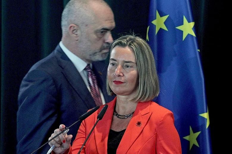 European Union foreign policy chief Federica Mogherini (front) and Albanian Prime Minister Edi Rama in Tirana, Albania. The move to start discussions for Albania to join the EU signals how the West is doing more to woo Balkan states away from Russian