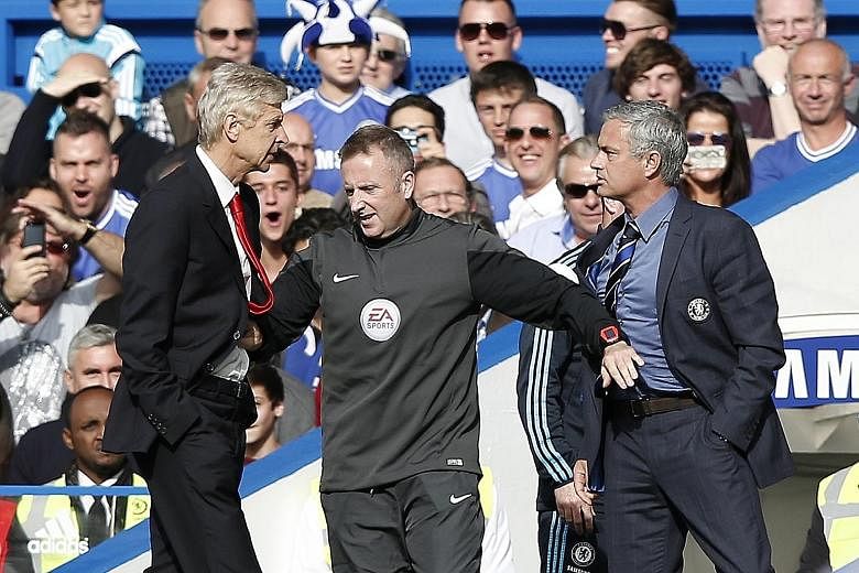 Arsenal manager Arsene Wenger and then Chelsea manager Jose Mourinho having a spat on the touchlines during a league game in October 2014. With Wenger leaving, their bitter feud is now water under the bridge.
