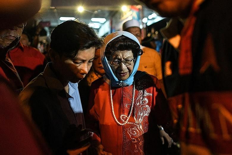 Tun Siti Hasmah Mohd Ali, seen here arriving at an election rally last week, says that aged 91 and 92, she and her husband avoid an over-hectic programme.