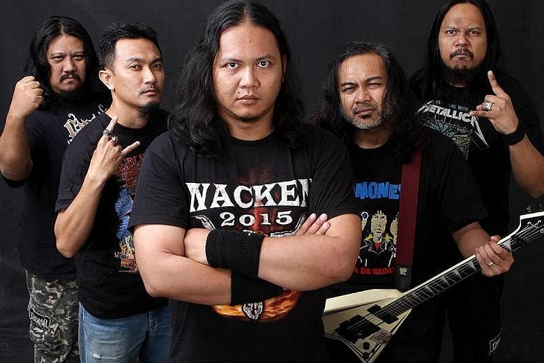 Mr Mustafa Kamal Abdul Rahman (second from left) with his band mates. The drummer in heavy metal band Farasu since 2002, he was nominated by Parti Keadilan Rakyat to contest in Negeri Sembilan's Labu state.