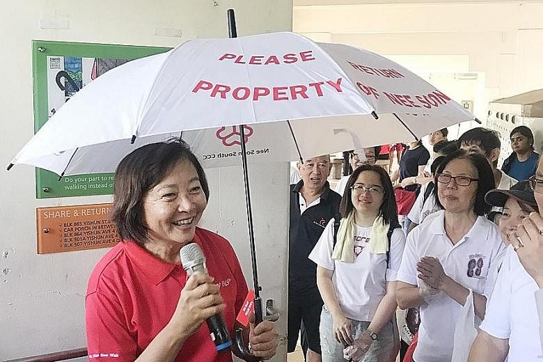 Nee Soon GRC MP Lee Bee Wah at the launch of the umbrella-sharing initiative, part of a series of activities to mark Earth Day, yesterday.