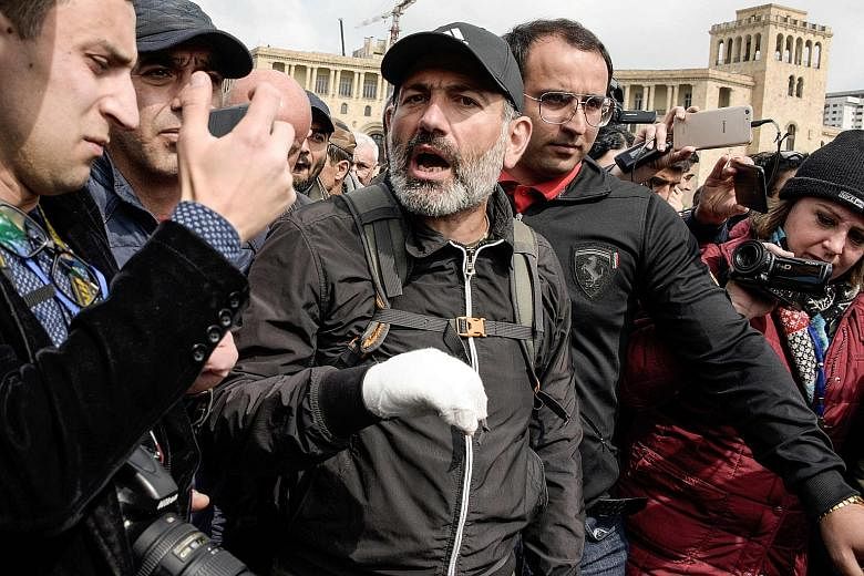 Armenian opposition MP Nikol Pashinyan speaking to the press yesterday after talks with Prime Minister Serzh Sargsyan abruptly ended. Mr Pashinyan has called for a nationwide campaign of civil disobedience in a bid to force Mr Sargsyan to resign, aft