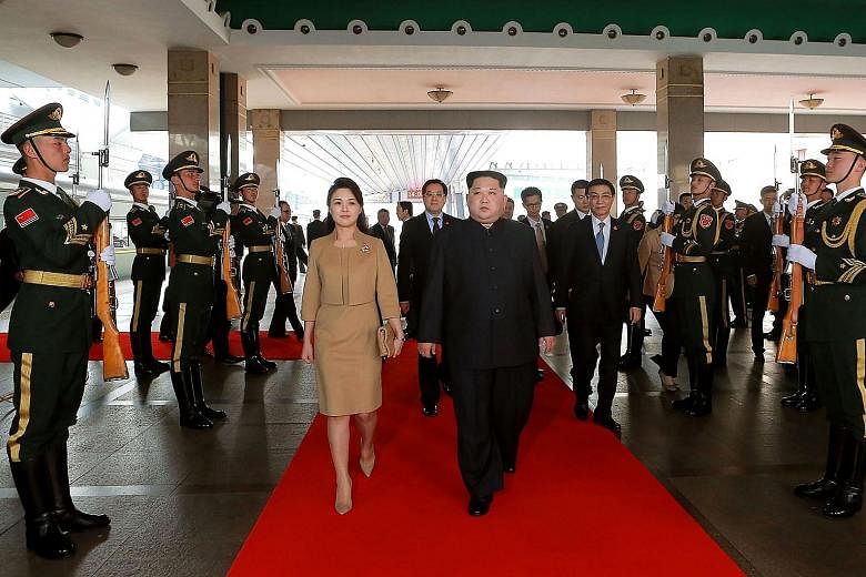 North Korean leader Kim Jong Un arriving in Beijing with his wife Ri Sol Ju last month. Ms Ri's media exposure has risen since then, in what is seen as a move by Mr Kim to establish the two of them as a "power couple".