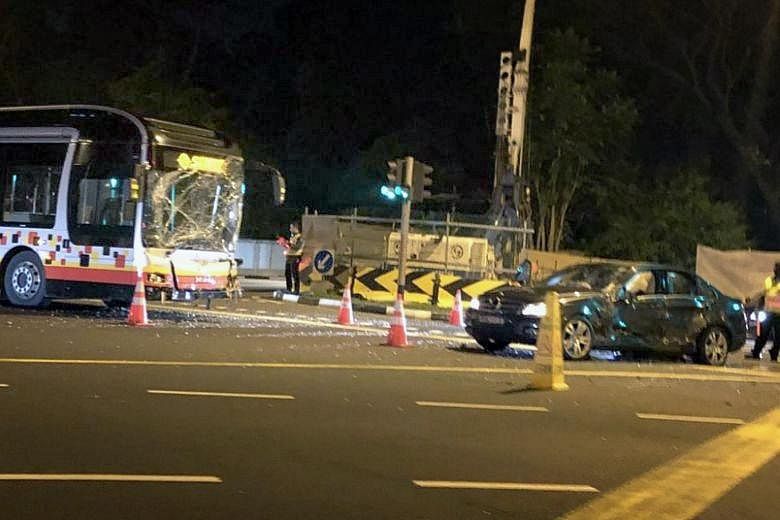 The SMRT bus and the Mercedes car after the accident, which took place at the junction of Jalan Anak Bukit and Jalan Jurong Kechil early yesterday morning.