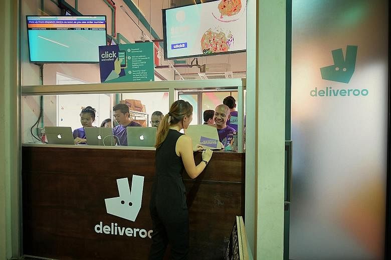 Above: Deliveroo Editions 2 in Lavender Street features seven restaurants. Right: The new outlet's food collection point.