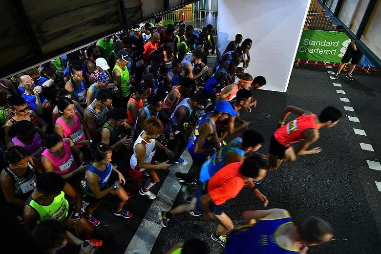 Runners being flagged off for the Standard Chartered Singapore Marathon 2017 in the early hours of Dec 3 in Orchard Road. After a marathon, runners should take time off for torn muscle fibres to heal. If you crave being active, go for a swim, or do a