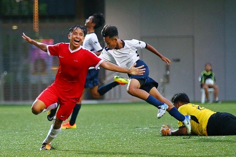 Sports School's Fathullah Rahmat wheeling away in joy after scoring their second goal in the final of the B Division Football Schools Premier League 1. They beat Meridian 2-0 at Our Tampines Hub to retain their title.