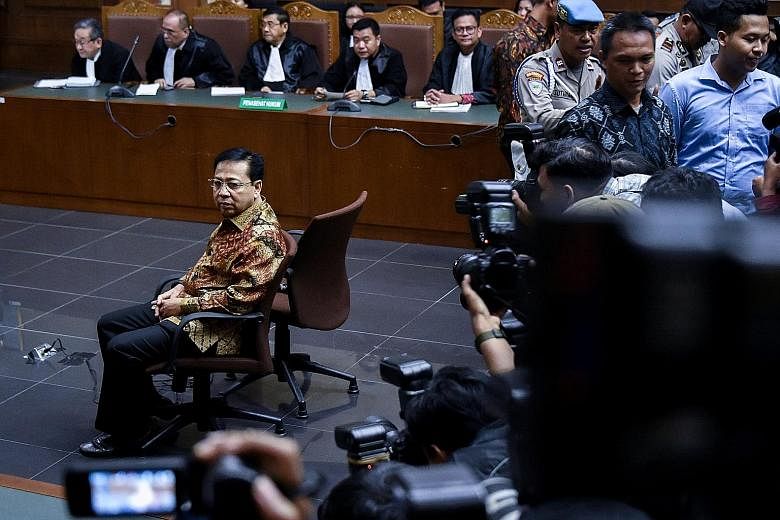Setya Novanto in court in Jakarta yesterday. In a session that ran for more than three hours, judges read out dozens of case notes, including descriptions of where he held meetings to divvy up cash from a mark-up on a contract for the identity card.