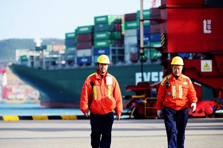 Chinese workers at a port in Qingdao, in China's eastern Shandong province. At the recent Boao Forum for Asia Annual Conference, Chinese President Xi Jinping announced a series of measures opening the Chinese market further and solemnly pledged that 