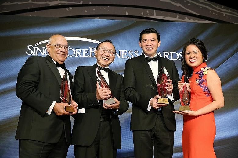 From left: Outstanding Overseas Executive of the Year Jaspal Singh, Businessman of the Year Lim Hua Min, Outstanding CEO of the Year Lee Seow Hiang, and Ms Adeline Sim, representing The Enterprise Award winner HRnetGroup, at the Singapore Business Aw