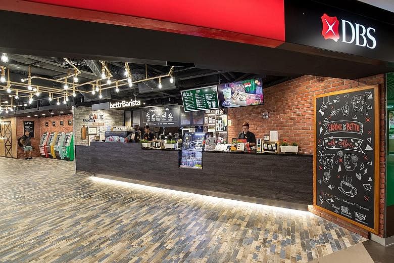 Designed with a cafe and branch concept, DBS' new lifestyle space at Plaza Singapura has an open layout. Customers walk in through a cafe where Bettr Barista, a social enterprise supported by DBS Foundation, operates.