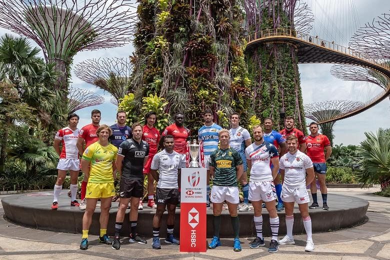 The captains of the 16 teams competing in this weekend's HSBC Singapore Rugby Sevens at the National Stadium posing at the Super Tree Grove at Gardens by the Bay yesterday. Singapore is the eighth leg of the 10-stop HSBC World Rugby Sevens Series, wi