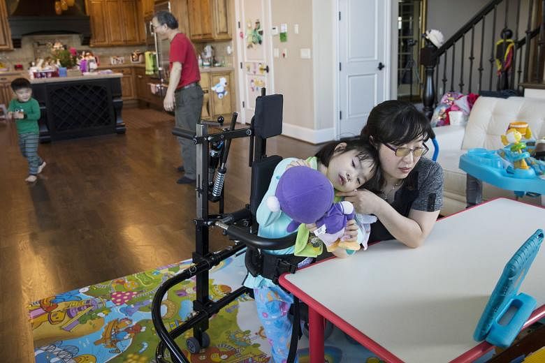 Dr Soo-Kyung Lee with her daughter Yuna in their Oregon home. Balancing the missions of science and motherhood, Dr Lee, who had worked with the FOX family of genes for years, began doing what she was uniquely positioned to do: aiming her research squ