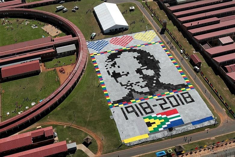 A massive Mandela masterpiece made up of crochet blankets was unveiled at Zonderwater Prison outside Cullinan, South Africa, on Tuesday. It is in celebration and memory of Mr Nelson Mandela's centenary year. The blankets will be handed out to the nee
