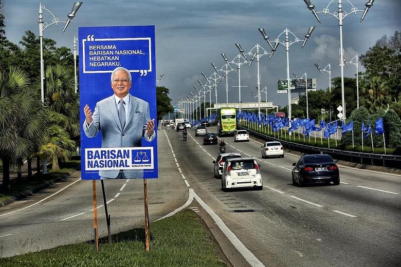A Barisan Nasional campaign poster of Prime Minister Najib Razak in Putrajaya. For the first time, the Umno-led BN must face an opposition led by a former premier.