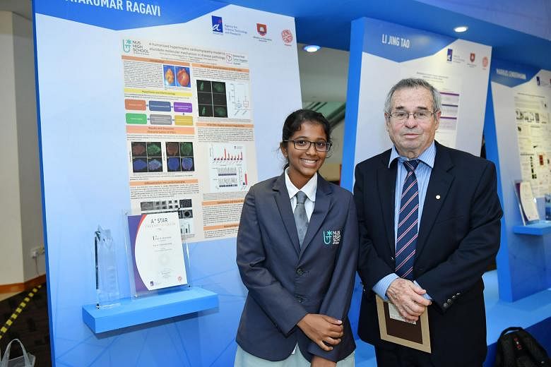 NUS High School student Vijayakumar Ragavi with Professor Arieh Warshel, the 2013 Nobel laureate in chemistry and chief judge of this year's A*Star Talent Search.