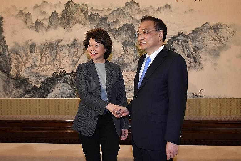 Chinese Premier Li Keqiang with US Secretary of Transportation Elaine Chao in Beijing on Thursday.
