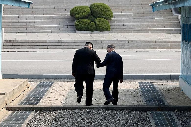 North Korean leader Kim Jong Un and South Korean President Moon Jae In shook hands for 22 seconds at the truce village of Panmunjom yesterday before Mr Kim invited Mr Moon to cross the Military Demarcation Line into the North Korean side. Mr Moon acc