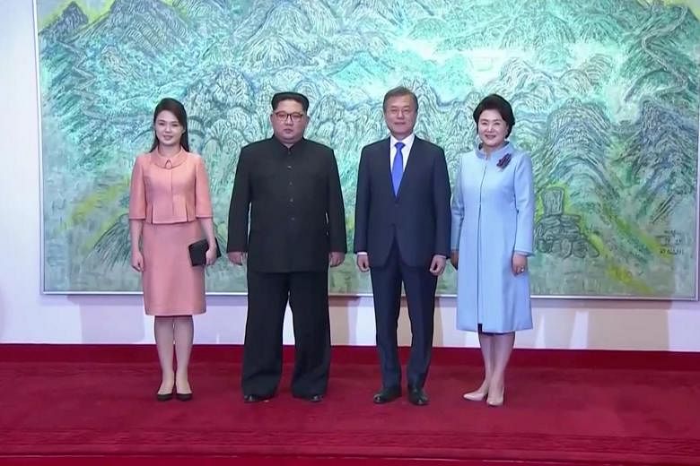 North Korean leader Kim Jong Un and his wife Ri Sol Ju with South Korean President Moon Jae In and his wife Kim Jung Sook at the summit yesterday. Ms Ri and Ms Kim were both professional singers before their marriages.